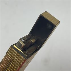 Dunhill gold plated dress lighter, in original fitted case with paperwork, together with a Dunhill rolagas lighter