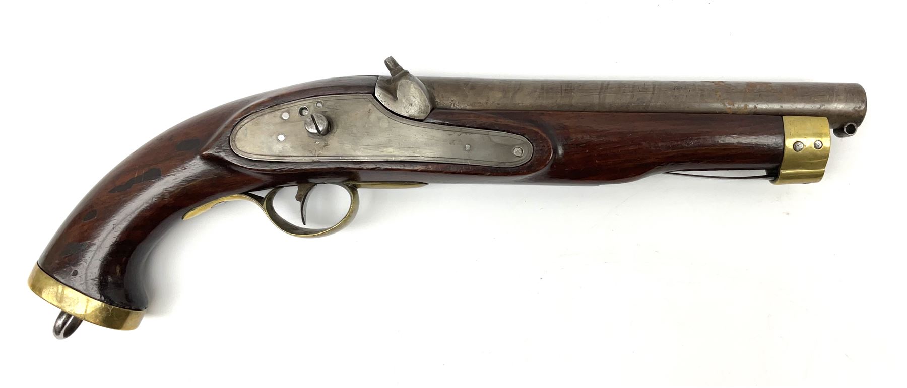 Early 19th century percussion cap cavalry pistol with round 23cm unsighted barrel, borderline engraved action lock (lacking hammer), walnut full stock with heavy brass furniture, iron lanyard ring to the flat butt cap and long flat retaining spring below fore-end for captive ramrod (missing) L41cm overall