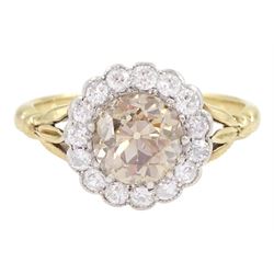 Early 20th century 18ct gold old cut diamond cluster ring, the central fancy light brown diamond of approx 1.60 carat, with a milgrain set white diamond surround of approx 0.45 carat, with Guest & Philips insurance valuation