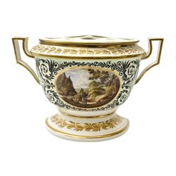 Early 19th century bough pot, probably Derby, of demilune form with twin handles and removable pierced cover, upon a spreading foot, decorated with a central oval hand painted panel of figures in a pastoral riverside landscape, with scrolling foliate surrounded and gilded foliate borders to the rim and foot, with painted mark beneath, H19cm L30.5cm