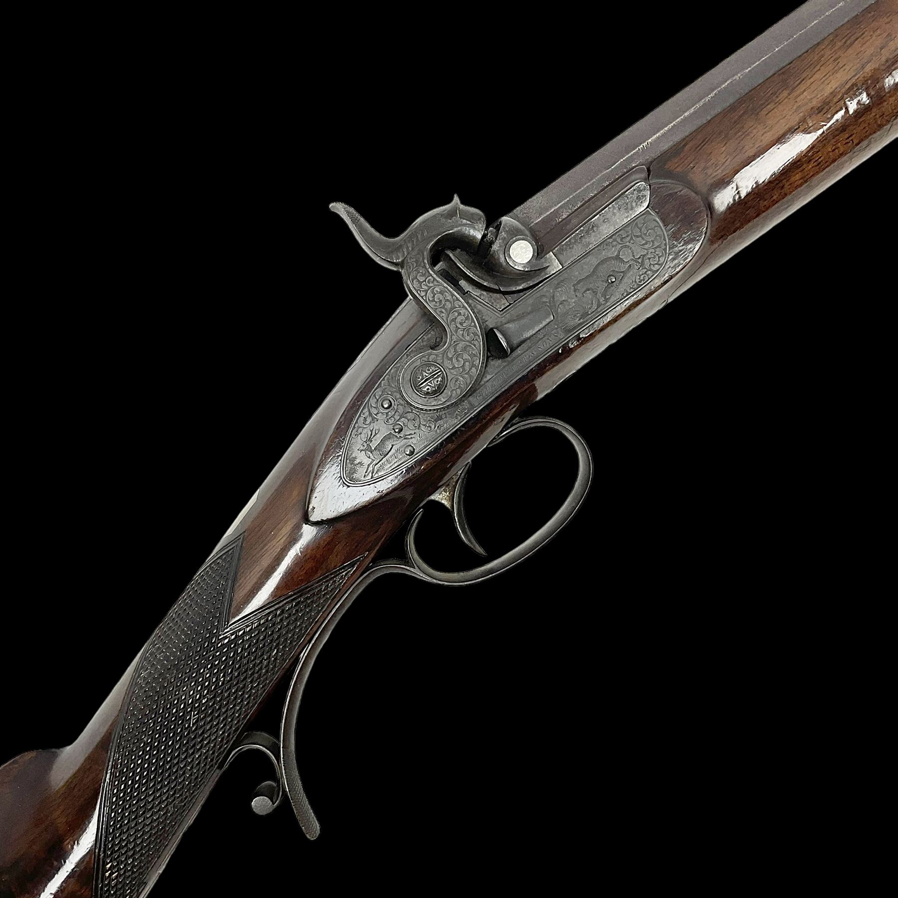 Mid-19th century percussion rifle by Geo. Forrest & Sons of Jedburgh No.844, 79cm octagonal barrel (approx .45 bore) with folding foresight, the lock plate with dolphin hammer finely engraved with a tiger and a stag, trigger guard engraved with hounds chasing a stag, figured walnut half stock with chequered grip and original ramrod 121cm overall; with framed photograph of original owner Dr. A.B. Dresser and archive of related ephemera including manuscript letter from the makers to Dr. Dresser regarding the sight specifications.