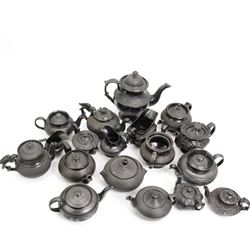 Early 19th century and later black basalt tea wares, mostly with relief or engine-turned bodies, including a Cyples bachelors teapot, other teapots, jugs etc in one box