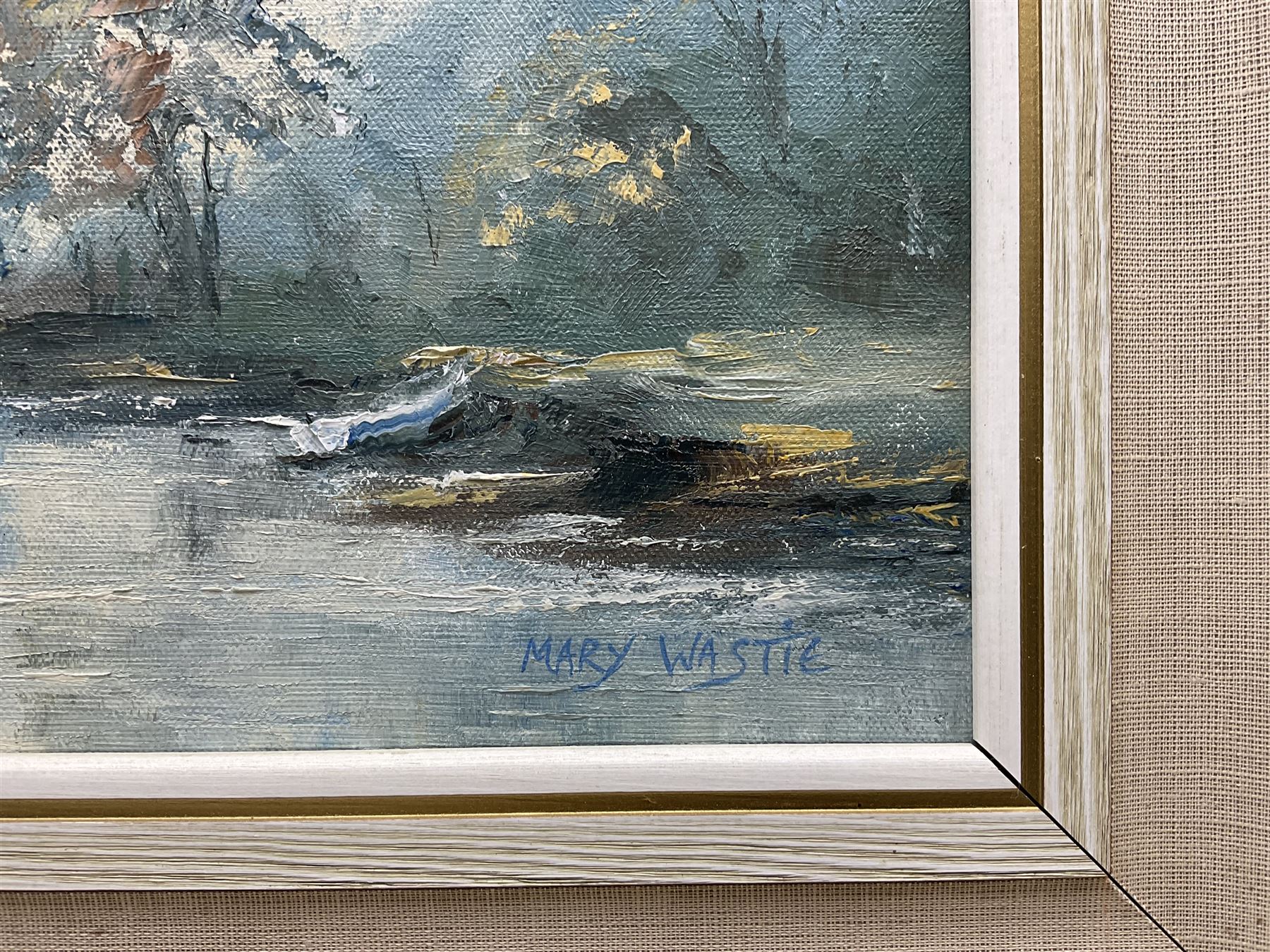 Mary Wastie (Cornish 1935-): Sunshine Over a Lake, oil on canvas signed 29cm x 44cm