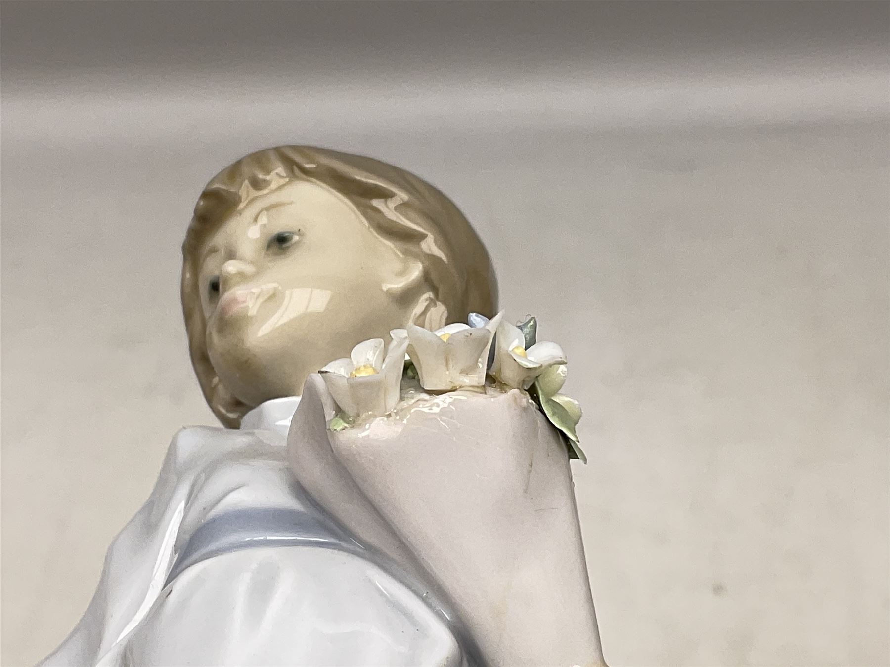 Three Lladro figures comprising, Pocket Full of Wishes no 7650, School Days no 7604 and Spring Bouquets no 7603, all with original boxes, largest example H26cm  