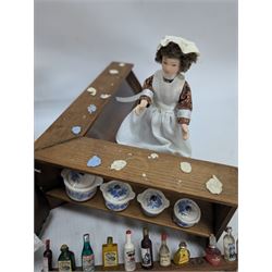 Victorian and later style dolls house kitchen furniture, including countertop, dresser displaying copper pots and blue and white ceramics, baking table, oven, three figures and a collection of food and baking accessories