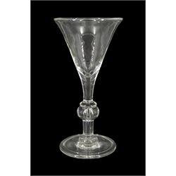 Large 18th century drinking glass, the drawn trumpet bowl upon a knopped stem with internal tear and folded circular foot, H23.5cm