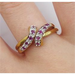 Two 9ct gold round ruby crossover rings, hallmarked
