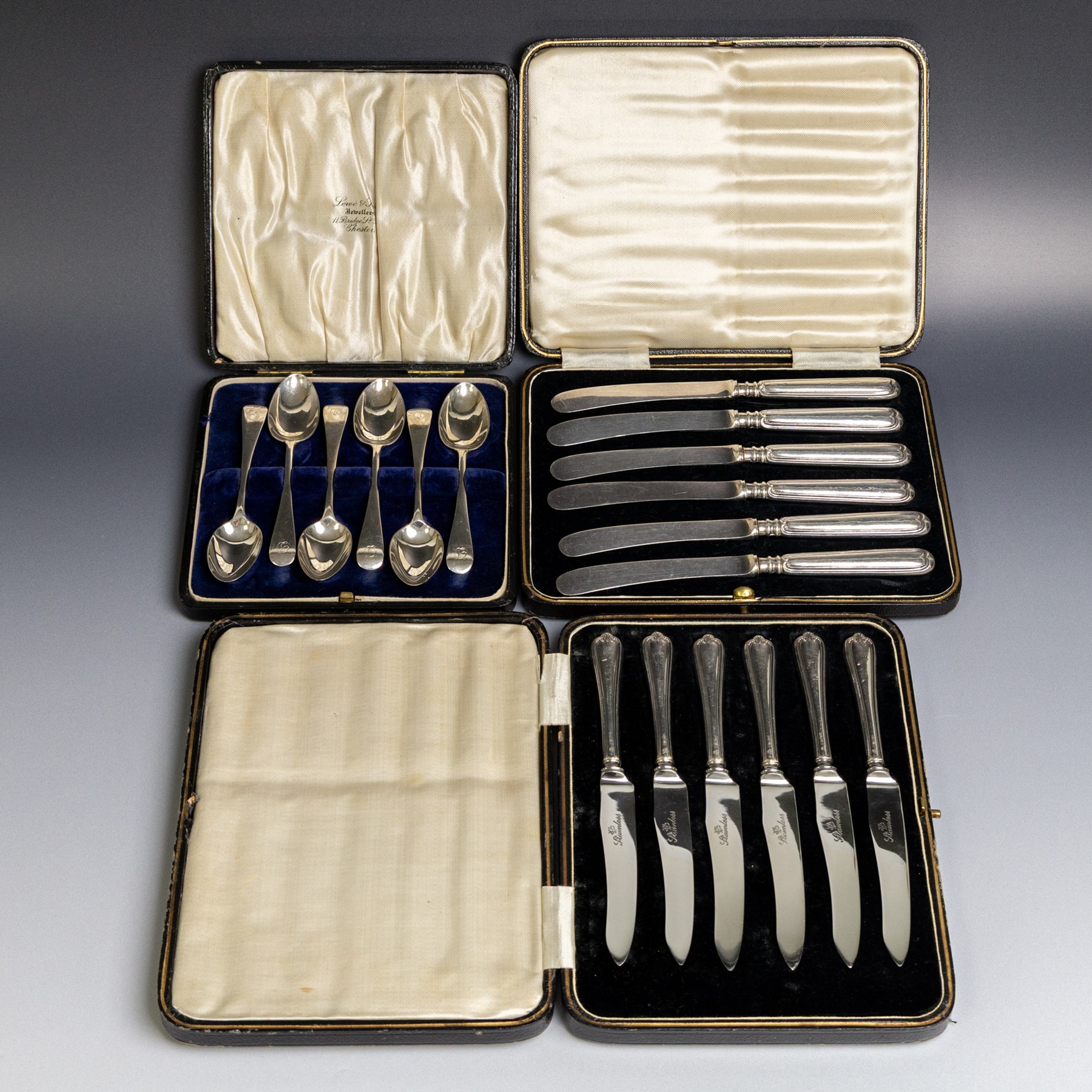 Set of six 1920s silver teaspoons with engraved initials, together with two sets of silver handled tea and fruit knives, all hallmarked and all within fitted cases