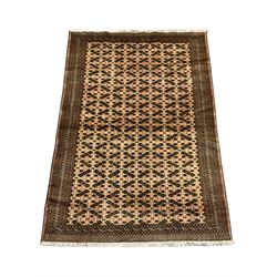Persian Baluchi rug, the field decorated with geometric motifs, repeating patterned border 