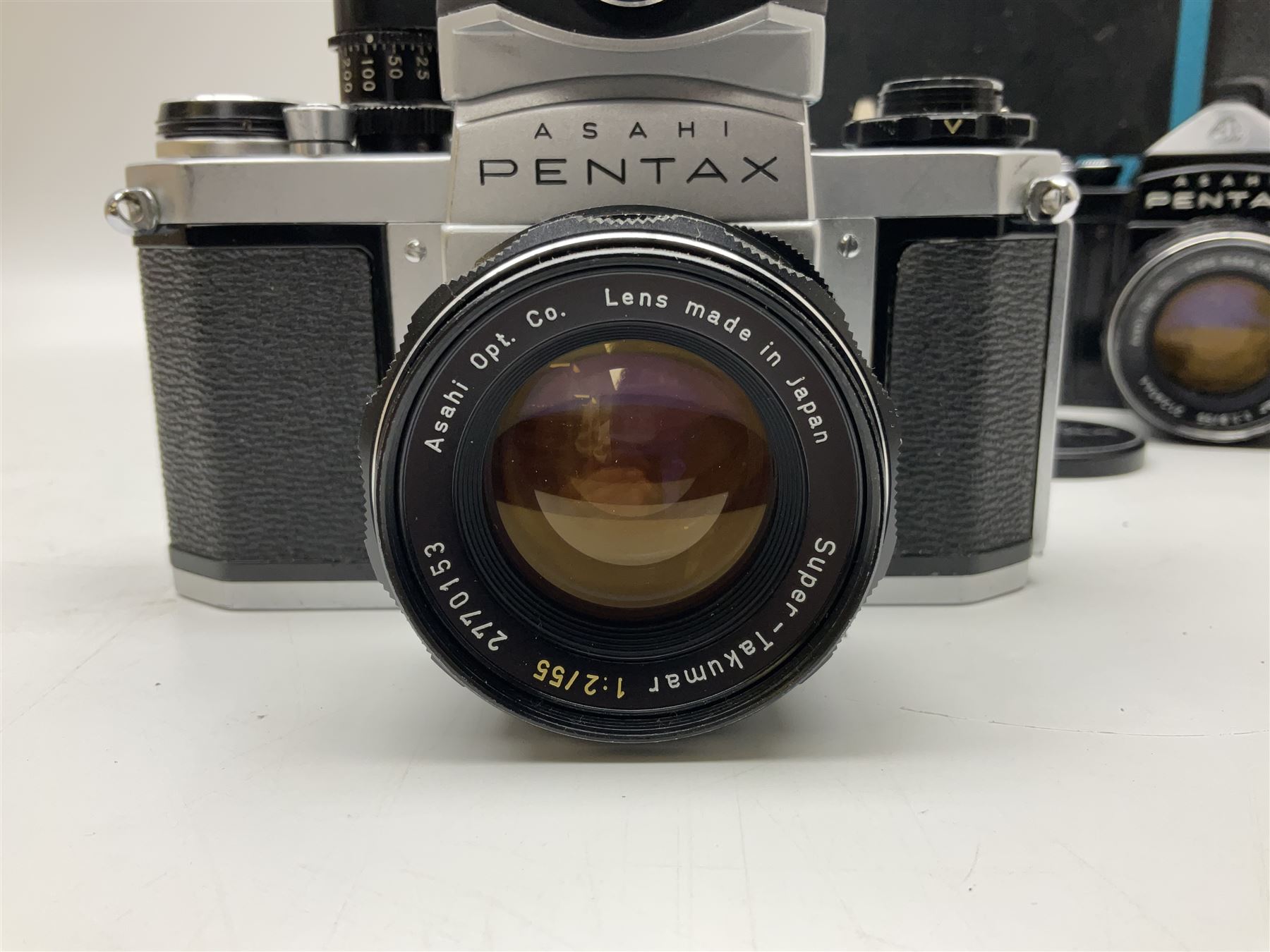 Asahi Pentax S1a camera body, serial no. 707071, with 'Super-Takumar 1:1.8/55' lens, serial no 2124044, together with Asahi Pentax Sv camera body, no. 1925617 with 'Super-Takumar 1:2/55' lens, serial no. 2770153, Asahi Pentax Meter, 'Super-Takumar 1:3.5/28' lens, serial no. 2075492 and 'Super-Takumar 1:4/150' lens, serial no. 1461613  