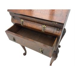 Small early 20th century Queen Anne style bookcase on bureau secretaire, the moulded arched pediment over mirrored door in shaped frame, the bureau fitted with fall front enclosing curved fitted interior, cushion moulded drawer over single drawer, on scroll and shell carved cabriole supports