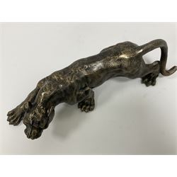 Cast metal figure modelled as a cougar in crouching pose, L40cm