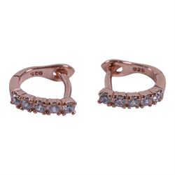 Pair of silver opal stud earrings, pair of silver blue opal stud earrings, pair of silver rose gilt cubic zirconia hoop earrings, silver ruby and opal ring, and silver gilt tourmaline ring