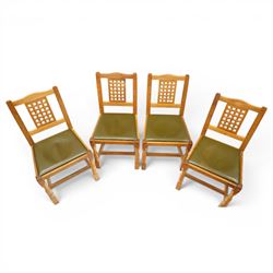 Beaverman - 1980s set of four lattice back dining chairs, shaped top rail above a lattice back, green leather fixed seat, raised on octagonal front supports, with carved Beaver to the back stretcher, by Colin Almack of Sutton near Thirsk