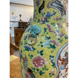 19th century Chinese famille rose yellow ground porcelain vase, of baluster form with twin applied mask ring handles, the body decorated with two shaped reserves mounted with dragon heads, depicting warriors at battle and at court, the neck with two smaller conforming figural reserves, upon a yellow ground decorated with exotic birds amidst scrolling blossom, H45.cm