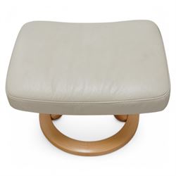 Ekornes - Stressless chair with stool, with padded arms and high backrest, raised on a circular mahogany-stained swivel base, fitted with reclining tension adjustment handle, supplied with stool with a lighter wood base 