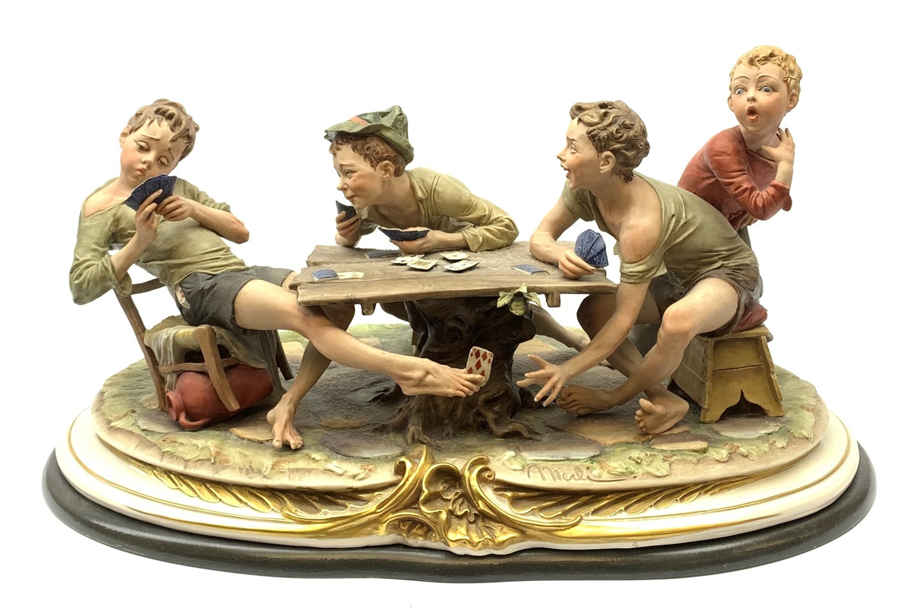 A large Capodimonte figure group, 'The Card Cheat', modelled as four