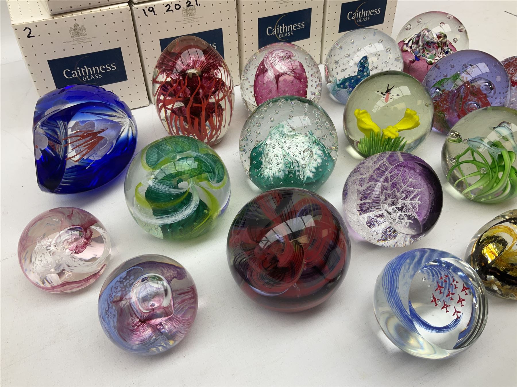 Eighteen Caithness paperweights, to include Myriad, Escapade