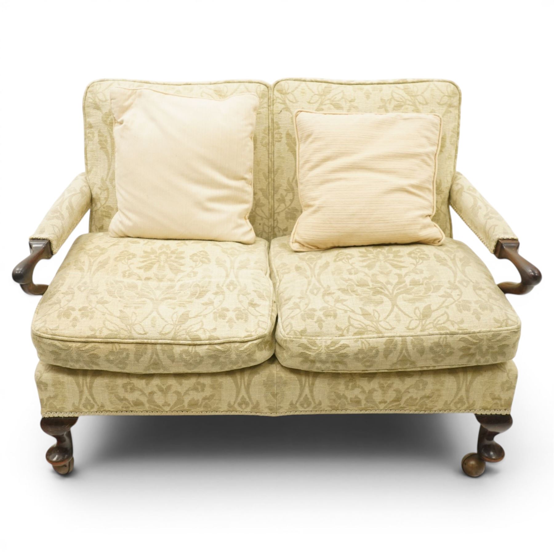 George II design mahogany framed three-piece salon suite, comprising settee and two armchairs, with pale green floral patterned upholstery, scroll carved arm terminals, loose cushioned seats and backs, raised on cabriole supports terminating in castors
Armchairs (H 80cm, W 62cm, D 73cm)