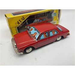 Five tin-plate model cars comprising MF326 Sedan Benz 1956, MF322 Standard Sedan in pink and white, MF763 Voiture de Course red racing car, MF264 Sedan and MF146 Sedan VW Beetle in yellow; all in original boxes 