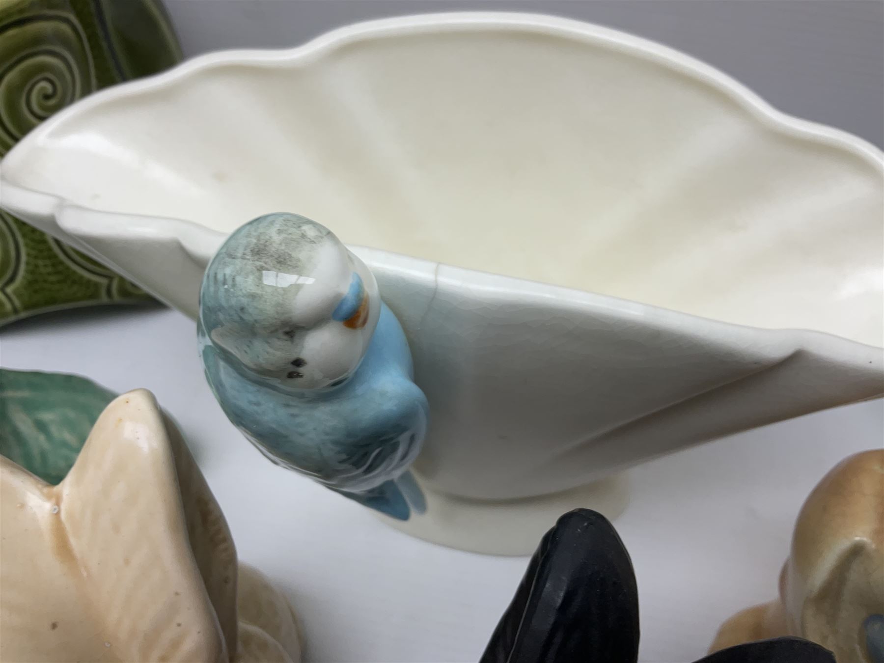 Collection of Sylvac and similar animal figures, including rabbits, hares and dogs, together with Falcon budgie vase, etc 