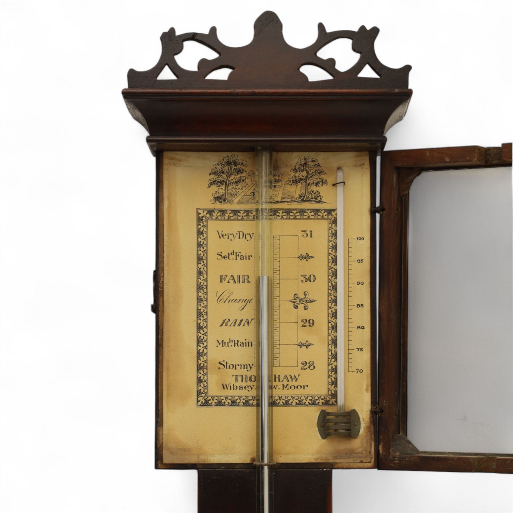 Thomas Shaw of Wibesy, Low Moor, (Bradford) - early 19th century mahogany bulb cistern stick barometer with a fretted pediment and an octagonal base, with satinwood stringing to the edge of the case and contrasting inlay to the cistern cover, enclosed paper scale with makers name, predictions and a Fahrenheit mercury thermometer, exposed tube with a conforming octagonal cistern cover.  
Thomas Shaw is recorded as working in the village of Low Moor 1820-40.
Basic stick barometers made in rural communities were often made for local farmers and were fitted with cheaper paper registers, many of which have not survived. This is a very nice and rare example found in very good condition.  