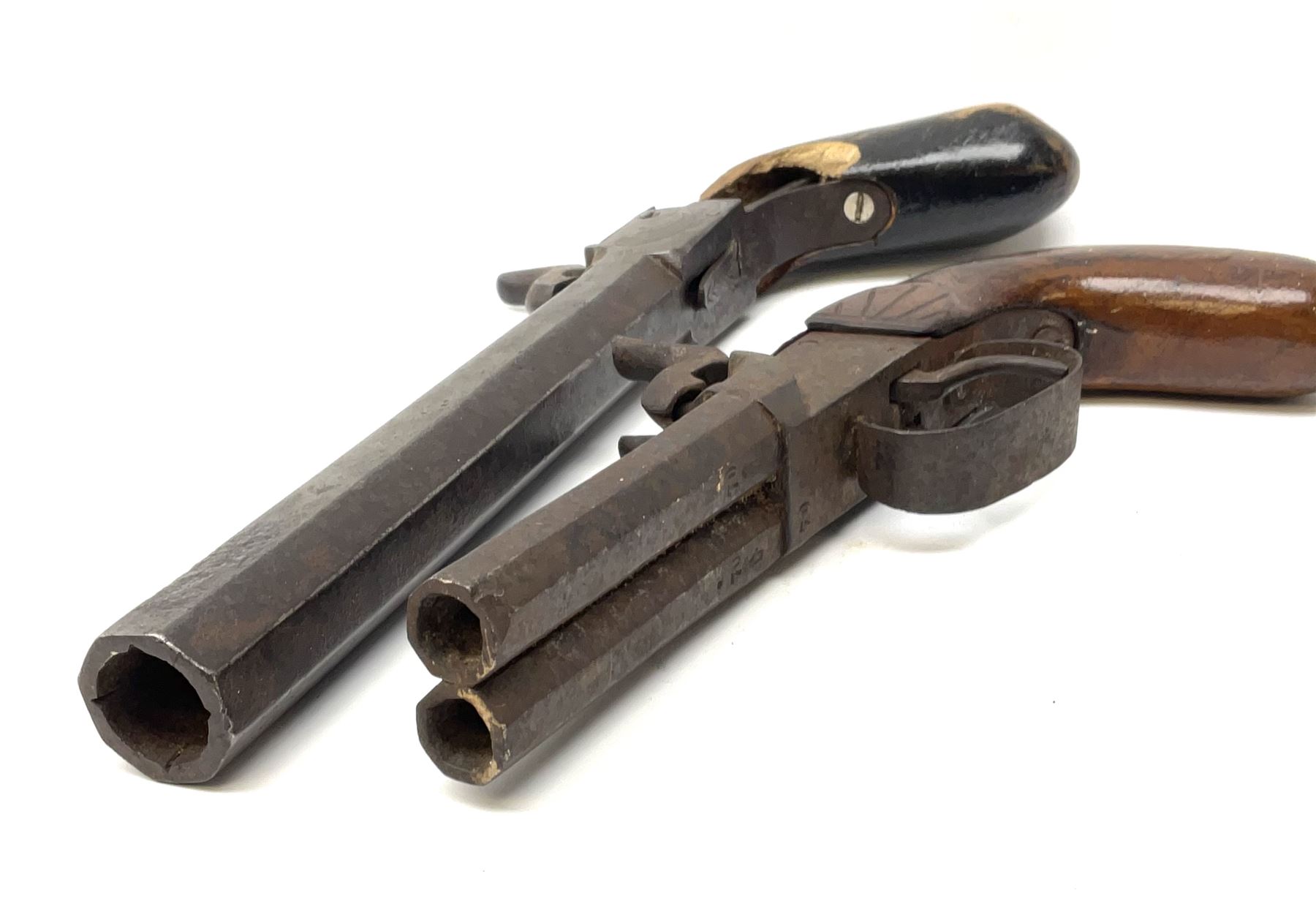 Mid-19th century percussion cap side-by-side double barrel pocket pistol with 7.5cm octagonal barrels and walnut bag stock L21.5cm; and Belgian 16-bore percussion cap pocket pistol with 16cm octagonal barrel, folding trigger and black painted wooden stock L27.5cm (2)
