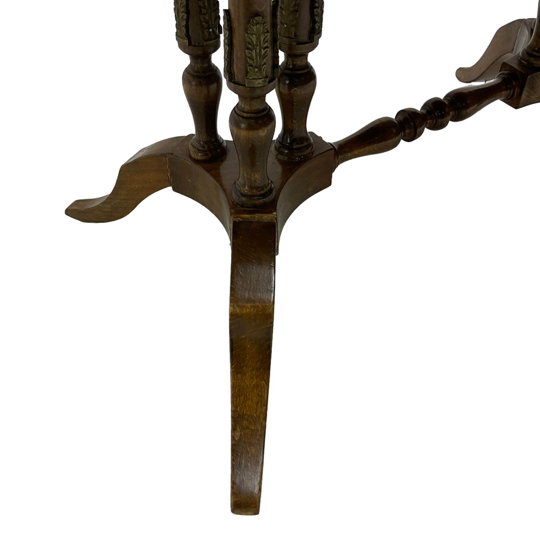 Early 20th century walnut coffee table, oval dished top with sunburst matched veneer, raised on twin cluster columns united by turned stretcher base on splayed supports