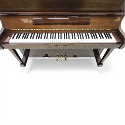 Bluthner of Leipzig upright piano, mahogany case with 88 keys and three brass pedals