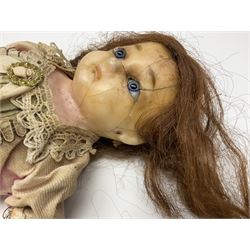 Victorian wax shoulder head doll with applied hair, inset glass eyes and jointed body with composition lower limbs; faded pink dress H35cm