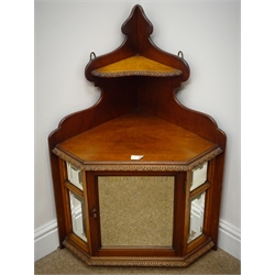  Late Victorian walnut corner cabinet, bevelled mirror glazed enclosed by single door (W58cm, H83cm) a far eastern style tracery pierced hanging wall rack, and a jardiniere stand (3)  
