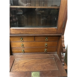  Victorian walnut secretaire bookcase, projecting cornice, three glazed cupboard above three fall fronts enclosing drawers and fitted interior, six cupboard doors, turned supports, W191cm, H207cm, D49cm  