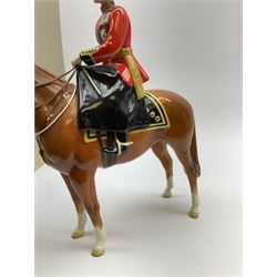 A Beswick model of HM Queen Elizabeth II mounted on Imperial Trooping the colour 1957, model no 1546, H26.5cm.