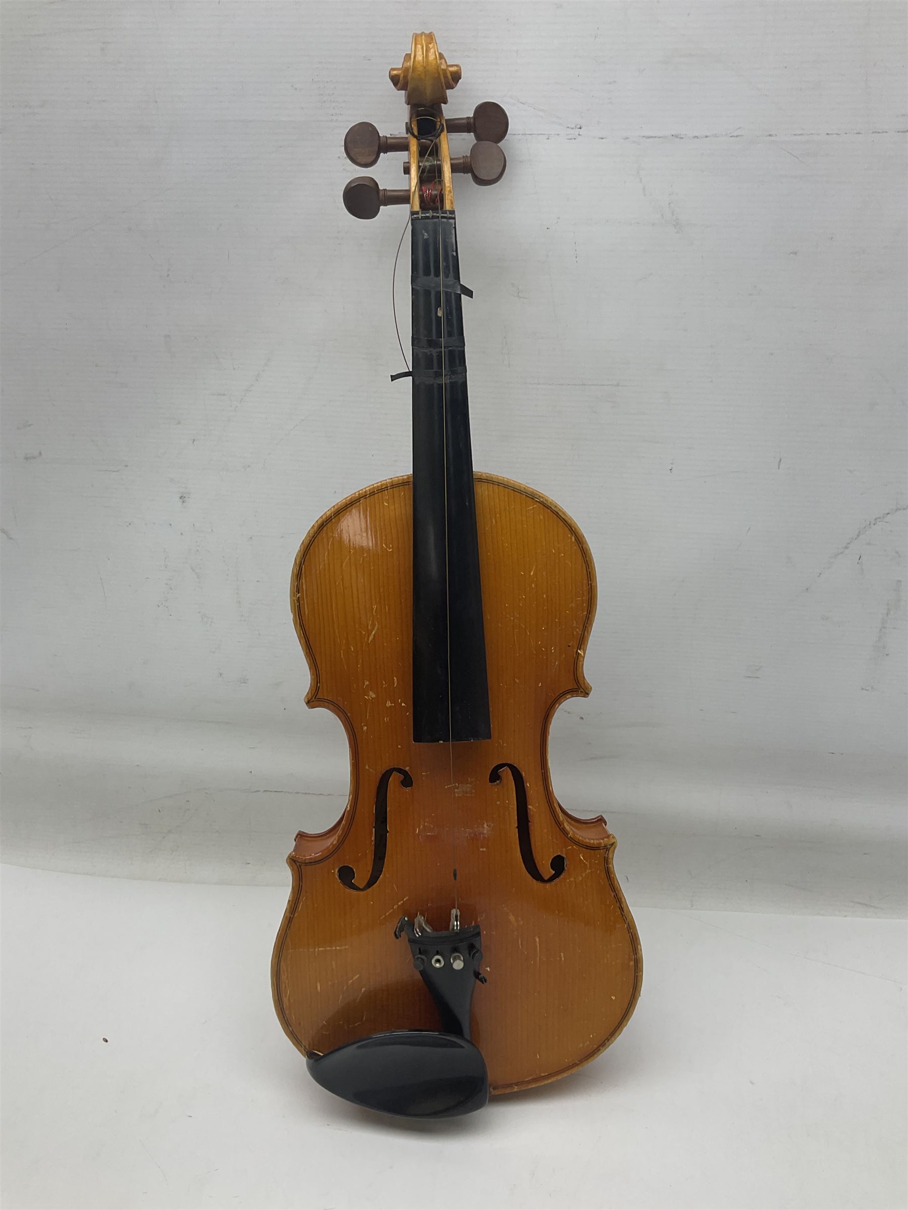 Four Chinese graduated violins - full size with 35.5cm two-piece back; three-quarter size with 33.5cm two-piece back; half size with 31cm two-piece back; and quarter size with 27.5cm two-piece back; all cased except full size; one with bow (4)