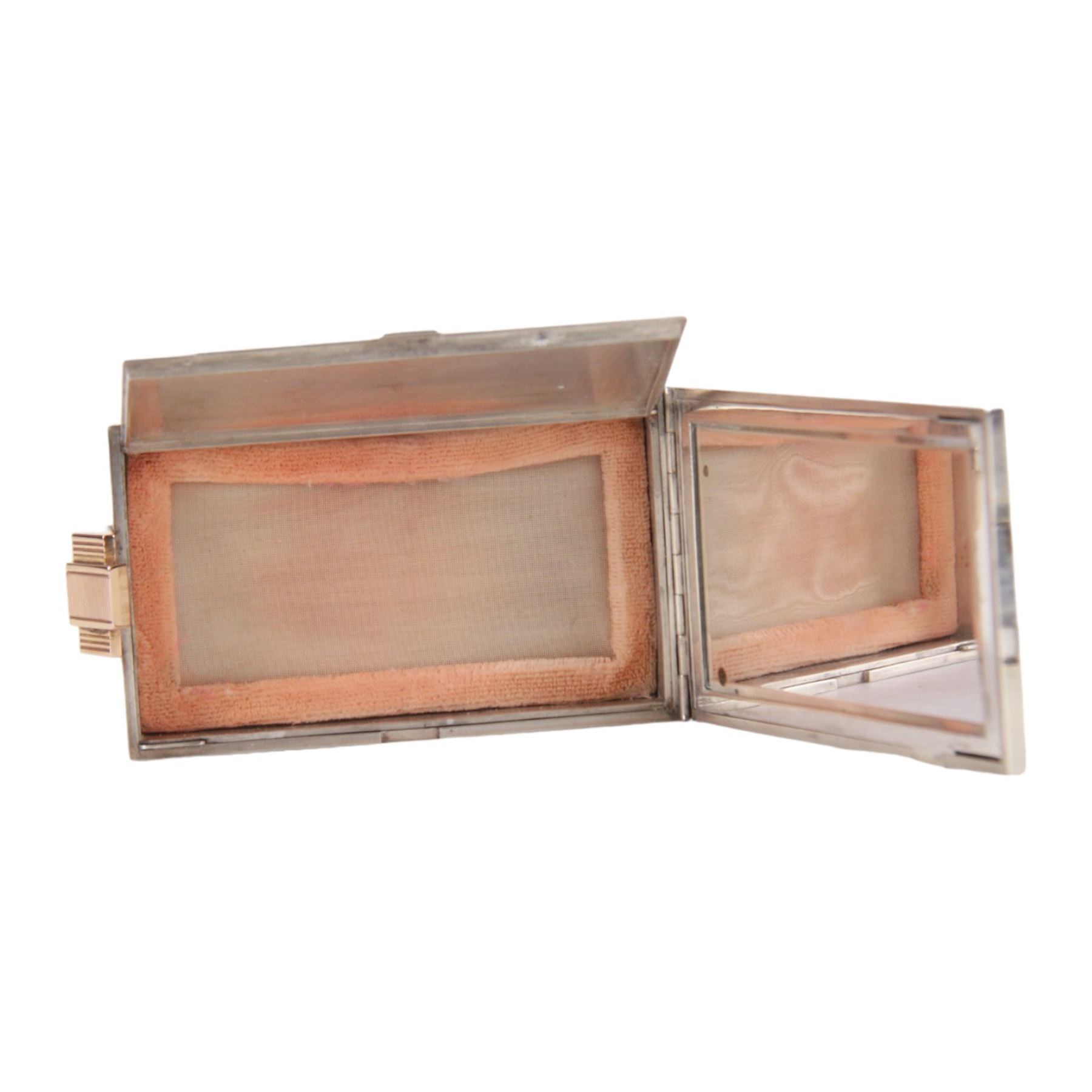 Mid 20th century French silver and gold vanity case, of rectangular form, the hinged cover decorated with an openwork panel of bids and cabochon ruby studded flower heads, opening via a pull clasp to reveal a mirror to the underside and compartment with lift up cover, signed J. Lacloche Paris Cannes, and bearing French assay marks, not including clasp L10cm W6cm D1.5cm

