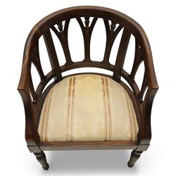 Late 20th century mahogany tub armchair, curved open back with pierced splat supports beneath a rounded top rail, upholstered drop-in seat in patterned fabric, raised on turned and ringed supports