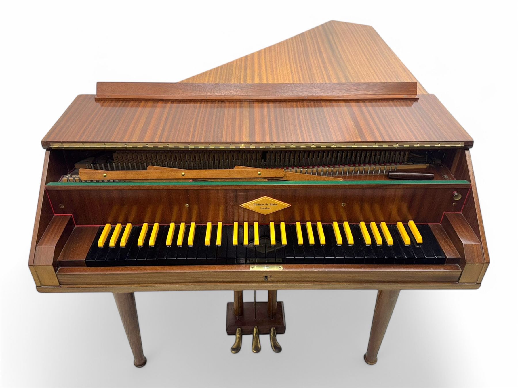 William de Blaise of London- mid 20th century Cembalo Traverso one manual Harpsichord in a teak case, with a five octave F1-f3 compass, two sets of strings and two rows of jacks, with three pedals and one hand stop, with one 8' and one 4', harp and piano to to 8', with a folding music desk and key fall, tuning key and tuning fork.
