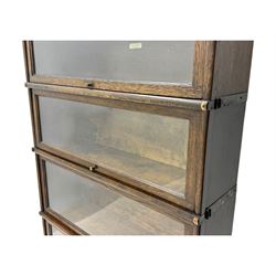 Globe Wernicke - stacking sectional library bookcase, over four glazed up-and-over doors, each bearing original makers mark, on moulded plinth base with inbuilt drawer