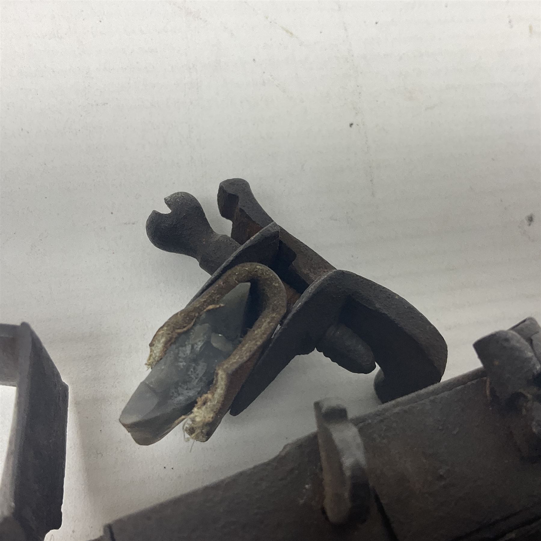 Late 18th/early 19th century flintlock tinder lighter, the steel box lock with hinged door to the left side, fruitwood butt with plain bar trigger, the left side set with a taper sconce and bipod front support, L21cm.