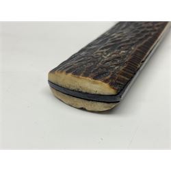 WW2 fighting knife, the 13cm blade by Priestman of Sheffield marked with scout and camp fire motif; two piece antler grip; in leather sheath crudely marked R.T. with a broad arrow L23cm overall Auctioneers Note: By family descent this knife was reputedly presented to Richard Towse during WW2 for guarding a group of POWs.