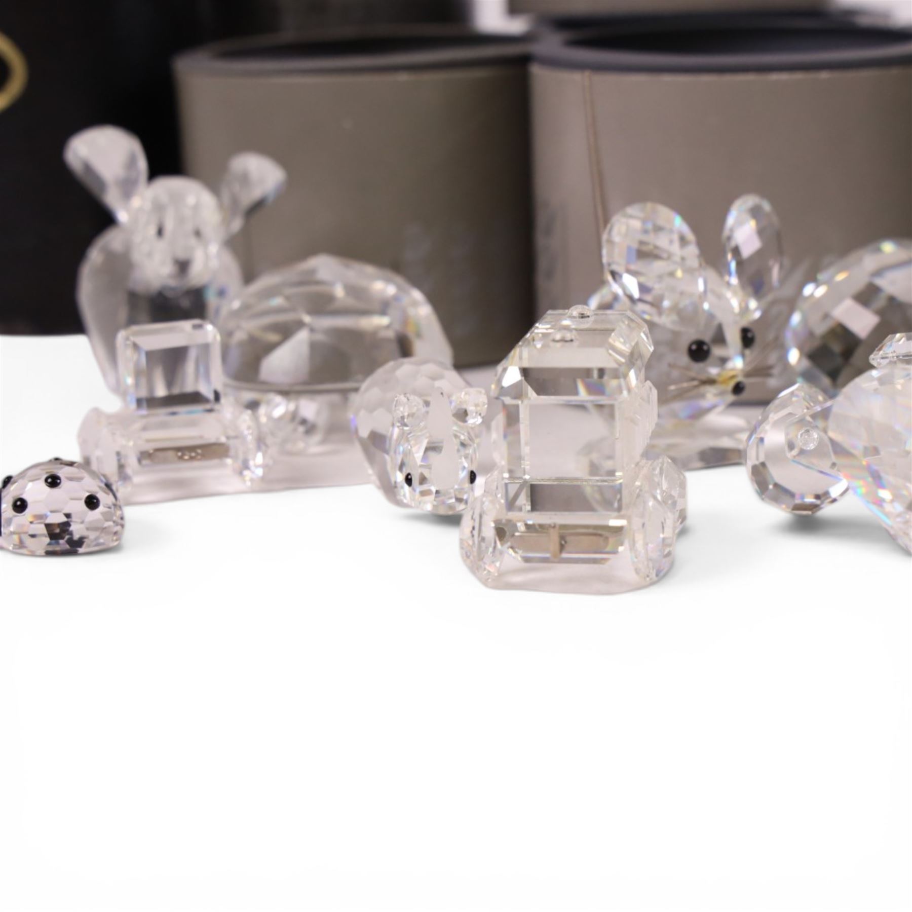 Collection of Swarovski crystal ornaments including train set, paperweight, towered building and many animal figurines, mostly in original boxes