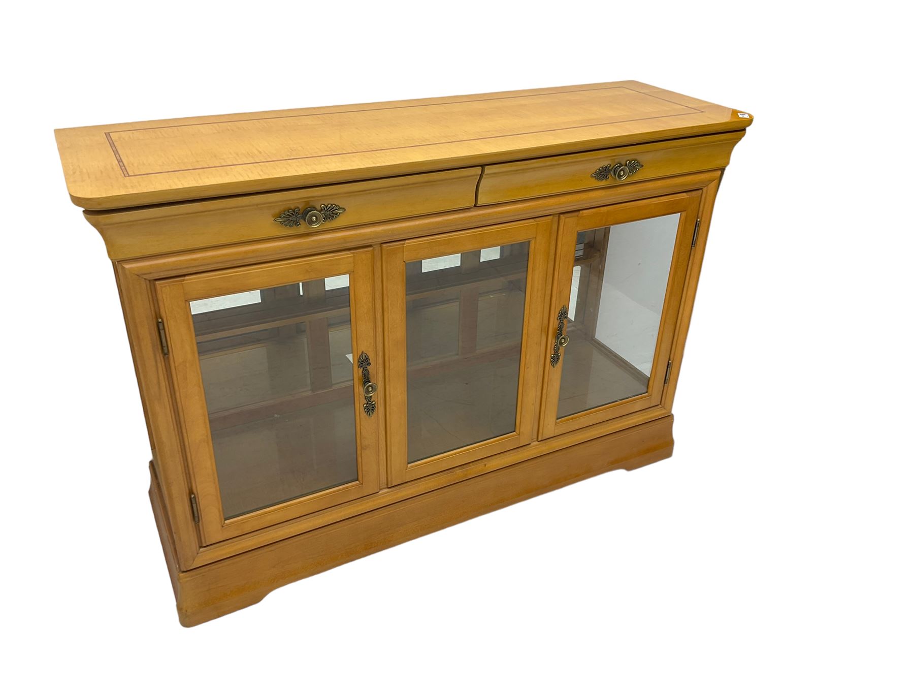 Yew wood sideboard, rectangular top with mahogany and ebony stringing, fitted with two drawers over three glazed cupboard doors enclosing glass shelves