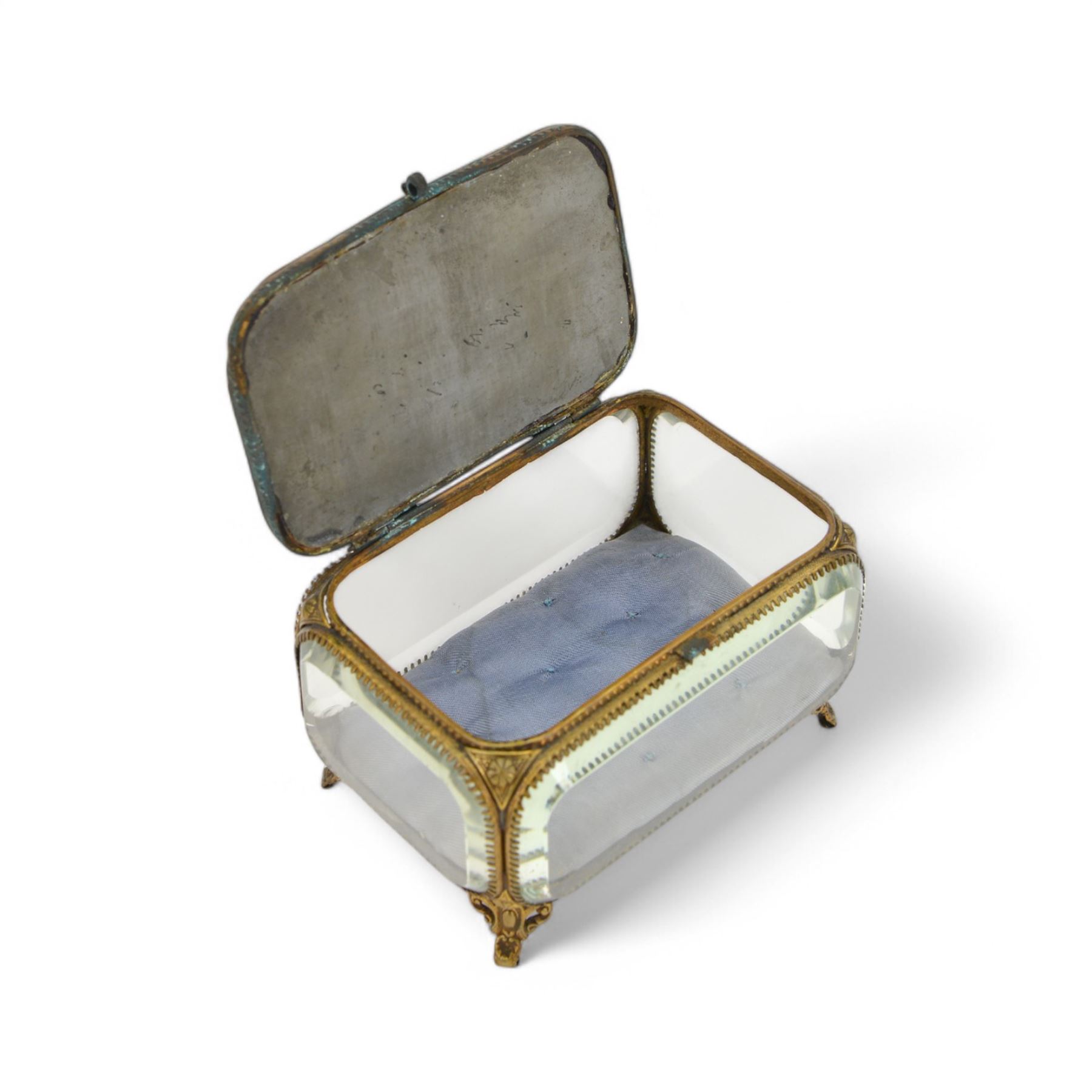 Micro mosaic jewellery casket with bevelled glass sides, the hinged lid decorated with with multicoloured raised flowers upon a blue ground, raised upon pierced gilt feet H10cm, L15cm