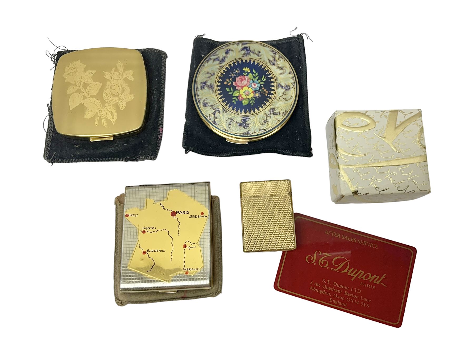 St Dupont gold plated cigarette lighter, with engine turned decoration, serial no EW1279, together with three powder compacts, including Stratton and Regent of London examples