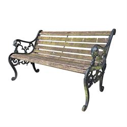 Pair of Victorian Revival Coalbrookdale design 'Dog and Serpent' pattern benches with slatted seats, the cast iron end supports of pierced and scrolling design with dog mask arm terminals