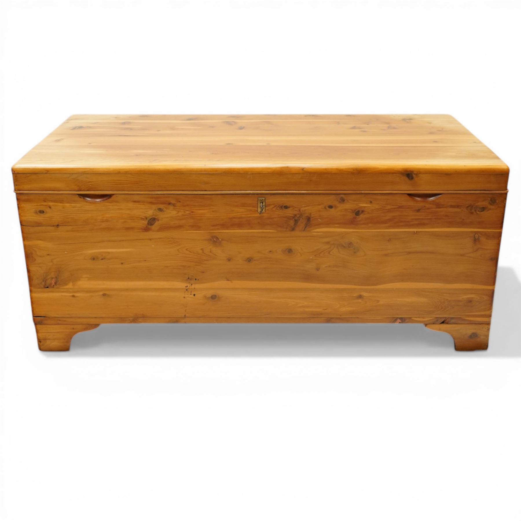 20th century American pine blanket chest, raised on bracket feet, makers label to interior