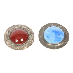 Six brooches, including one Ruskin example in silver mount, four Ruskin style brooches with ceramic roundels and a plated agate example