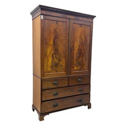 Early 19th century mahogany linen press cupboard, projecting moulded cornice over figured frieze, two panelled doors enclosing shelves, fitted with two short and two long cock-beaded drawers, on bracket feet 