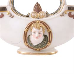 Royal Worcester double-ended vase, modelled in relief with mask panels in the classical dress the central handle with foliate and scroll work, H16cm 
