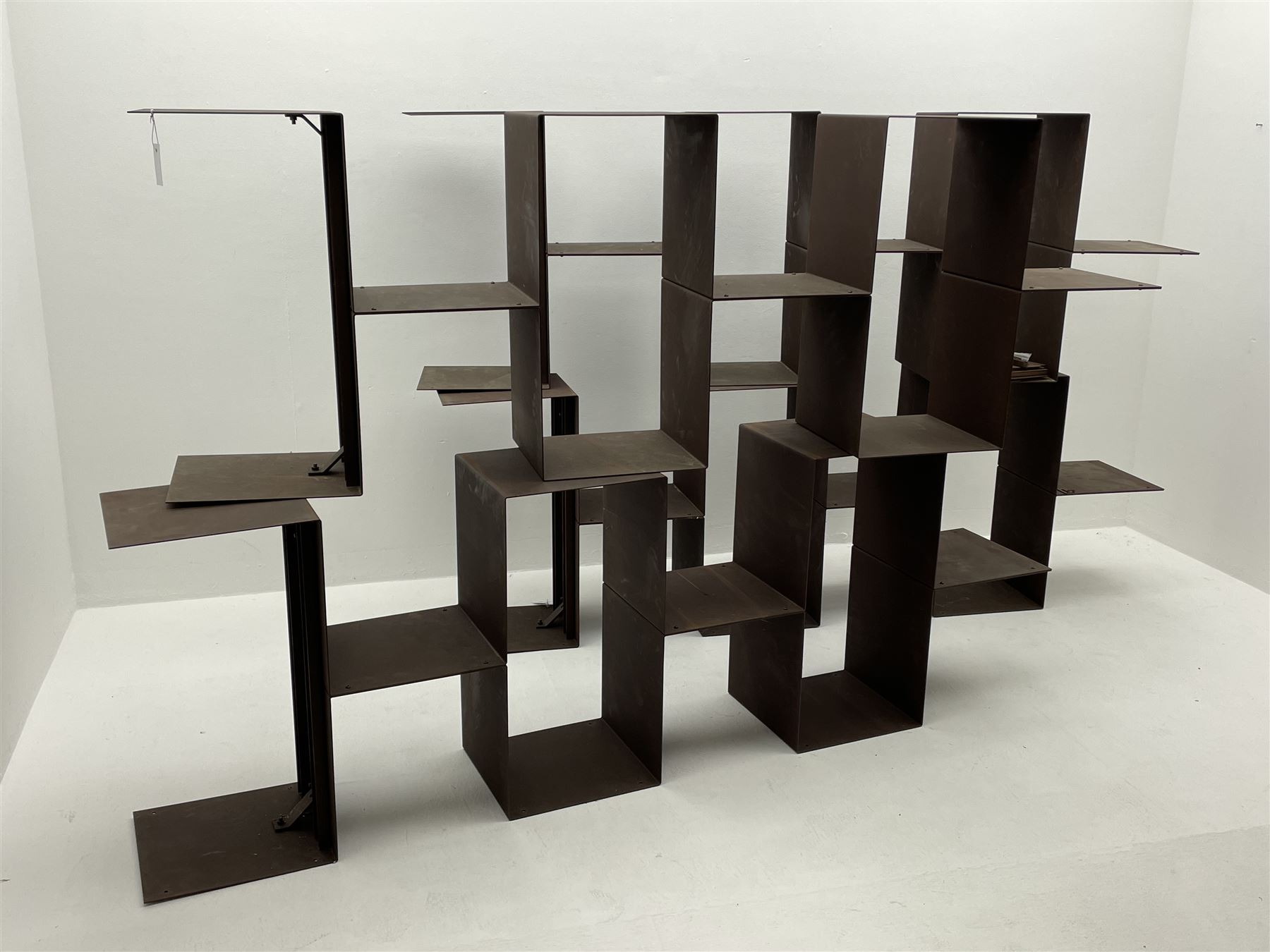 Retailed by The Conran Shop - four sectional modular shelving units, rusted metal finish, each unit - W212cm, H71cm, D33cm